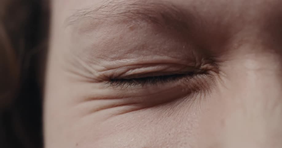 Closeup view of a woman closing her eyes