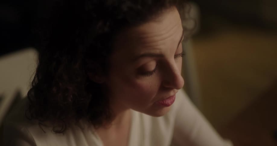 A woman is worried and brushes her hair back