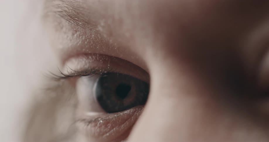 White person blue eyes blinking and looking around