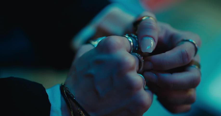 A woman clenches her fists