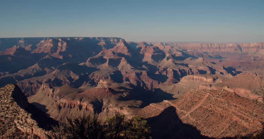 Aerial panoramic view of the grand canyon on a clear blue day