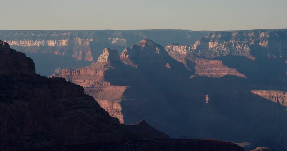 An enormous canyon in wilderness under a clear sky