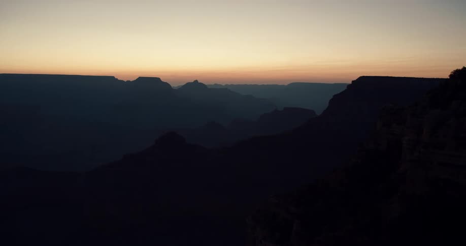 Aerial view of the sun setting in the horizon is displayed