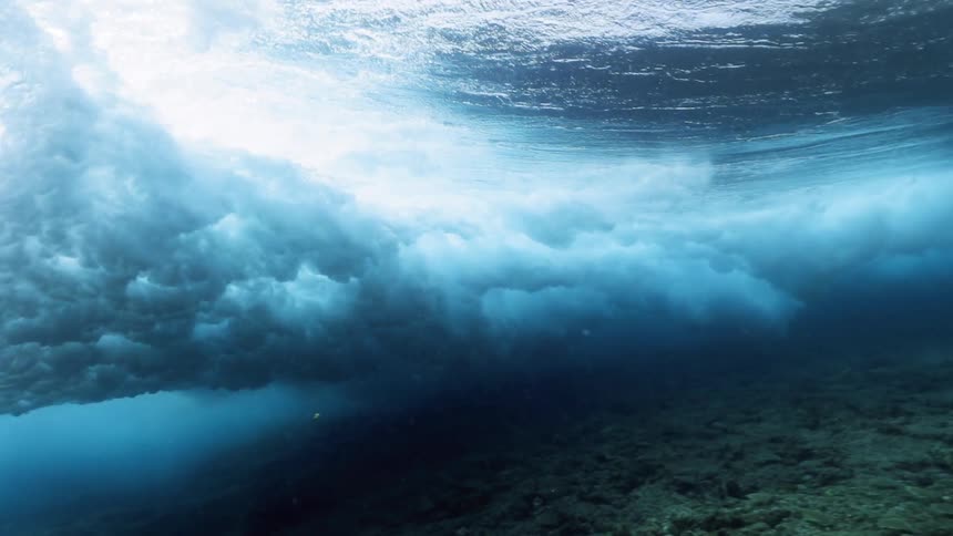 Waves breaking from underwater in the surf