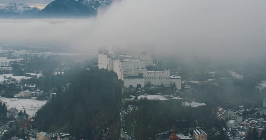 Aerial view of hohensalzburg fortress in the city of salzburg under the clouds