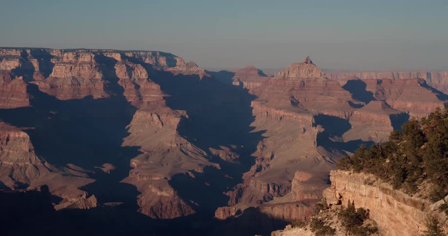The canyon is tall and covered in shadow