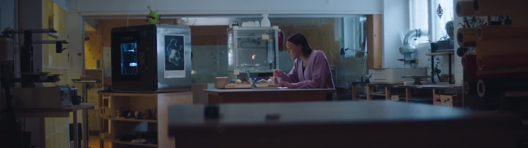 A woman using a laptop in her place of work