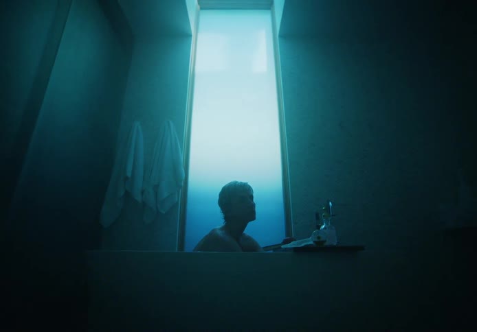 A woman is taking a shower in a bathroom