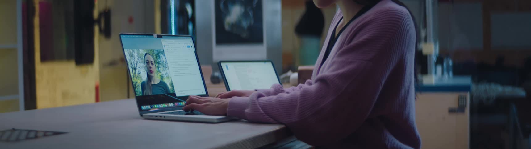 A woman is video chatting with someone on a laptop