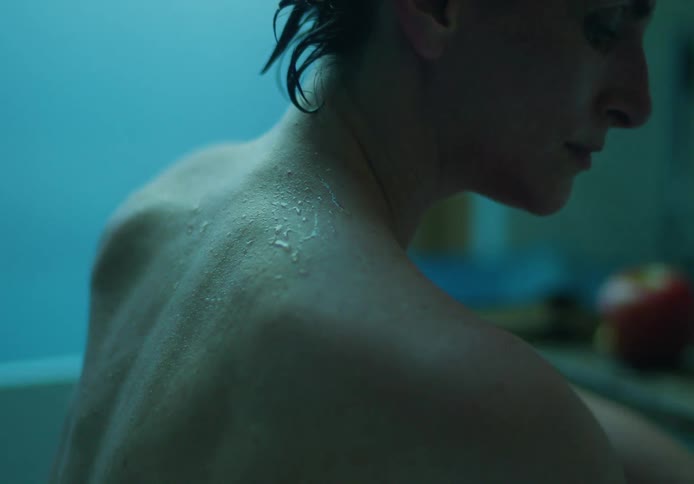 A person is taking a bath in a bathroom