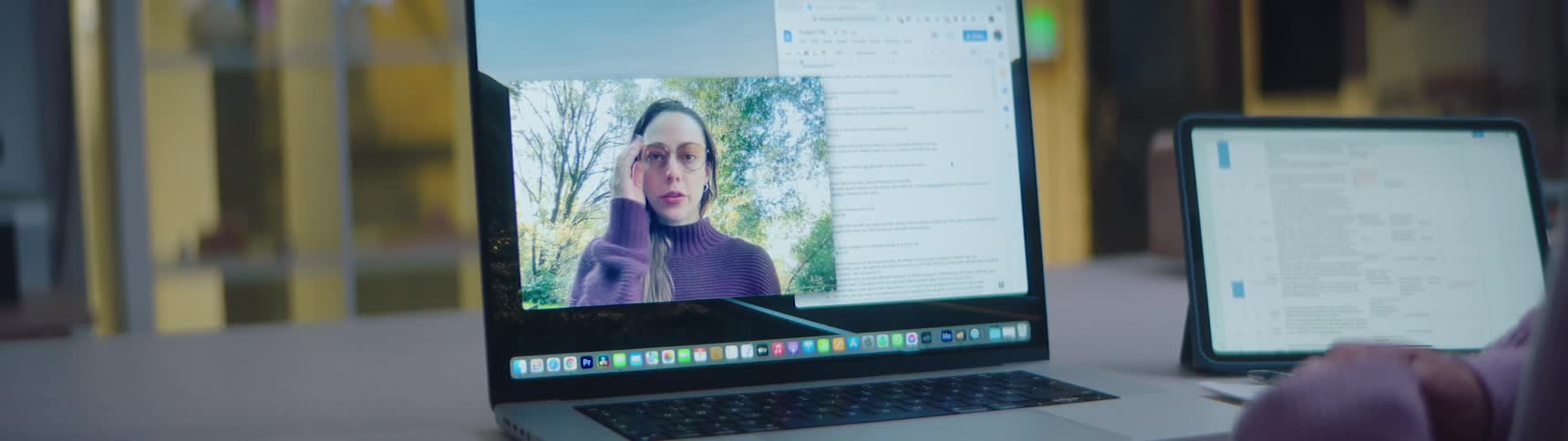 A woman is video chatting with someone on a laptop