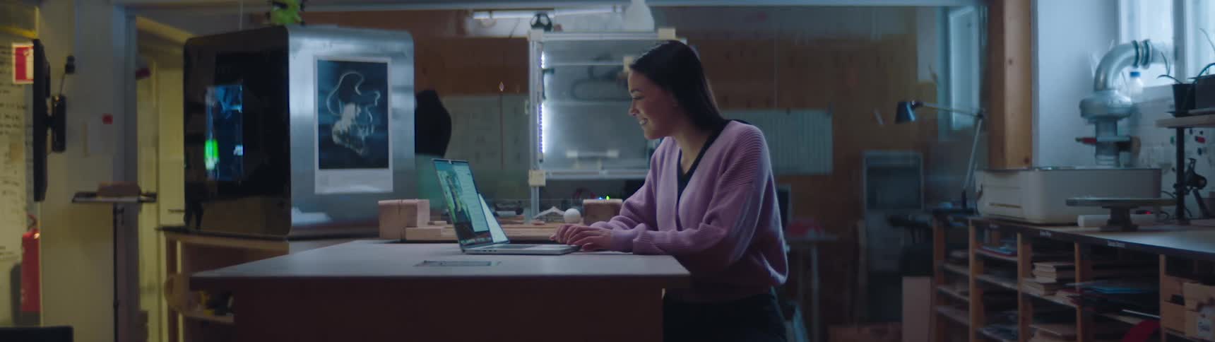 A woman is working on her laptop