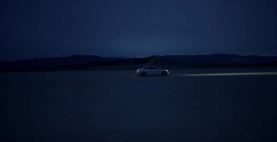 A car drives across the desert