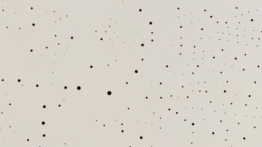 a blue liquid shrinking into dots chemical oscillation
