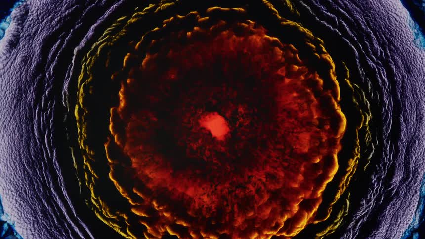 A circle of purple clouds emerge with an explosive mix of red and orange erupting from the center
