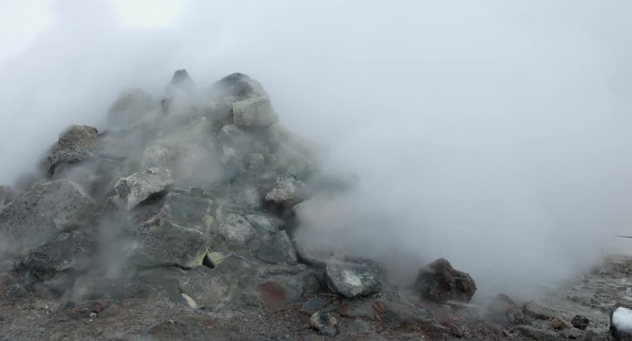 geothermal Steam coming out from a pile of rocks