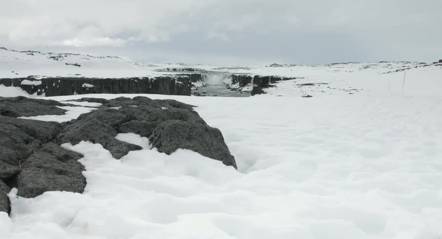 A snowy area near a river