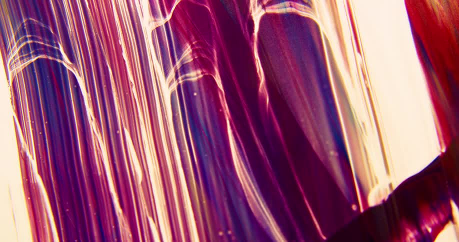 A graphic design mimics lines of melting paint in purple tones