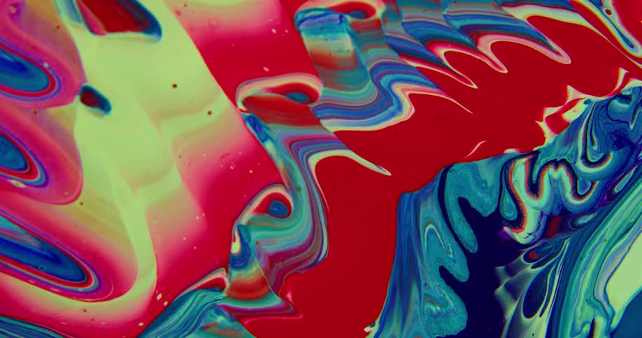 Color paints swirl together to form a tie dye pattern