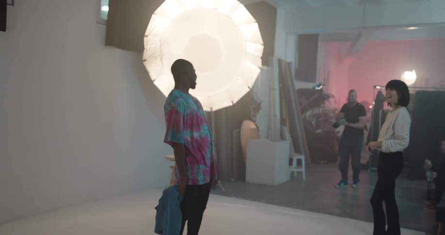 A photographer is taking pictures of a model