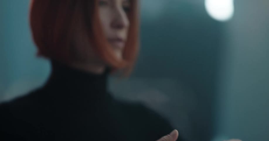 A woman is taking a selfie with her cellphone