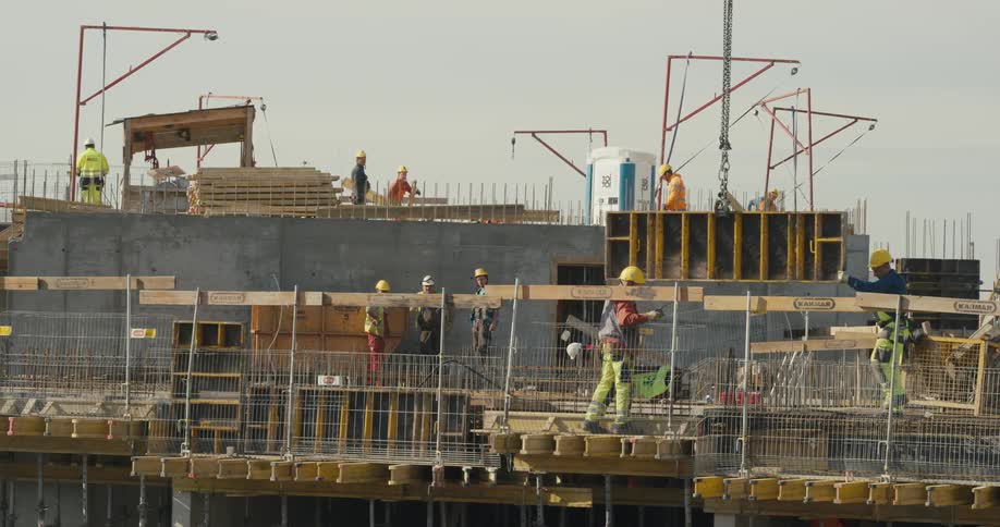 A group of construction workers are outdoors