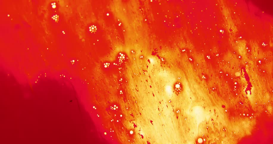 Water stream washing away thick dark red ink clingin on a translucent surface