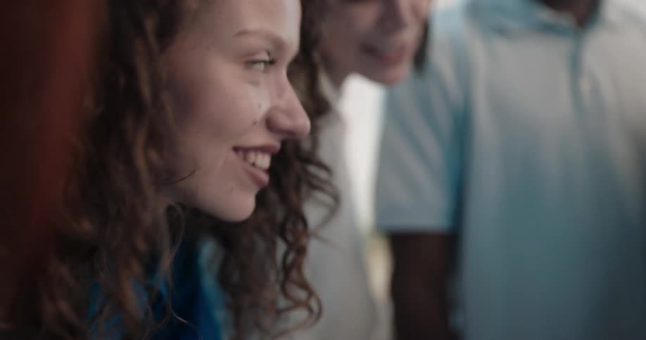 Friends huddle together talking