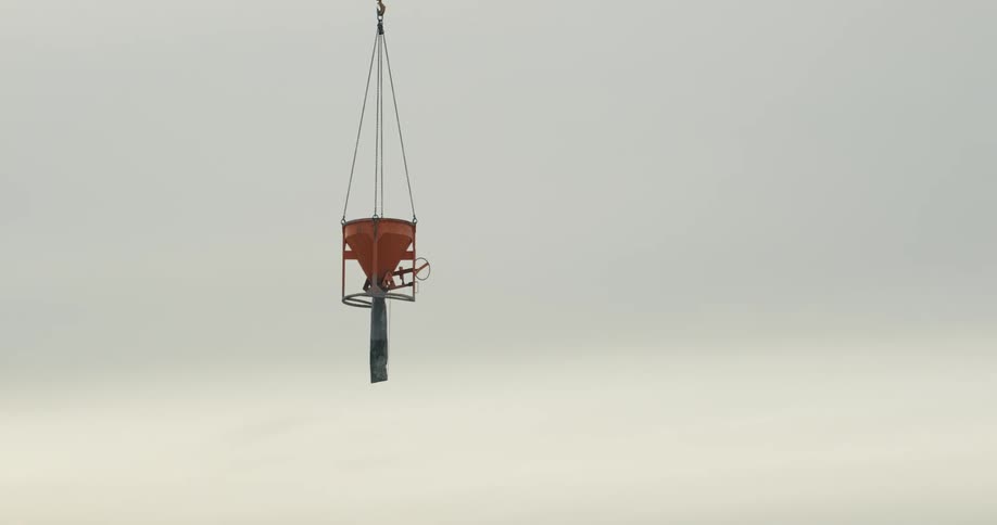 Cement funnel is being moved with a crane