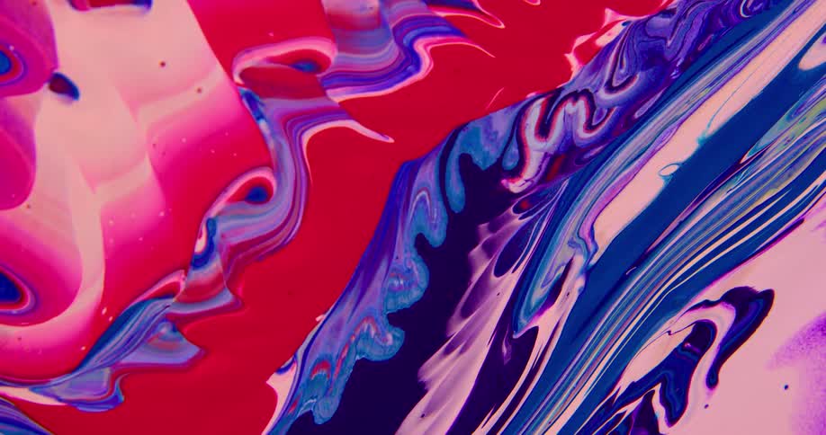 Surface covered with streaks and blobs of psychedelic colorful moving liquid ink
