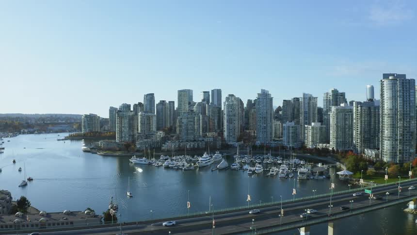 Aerial view of Vancouver near a body of water is displayed