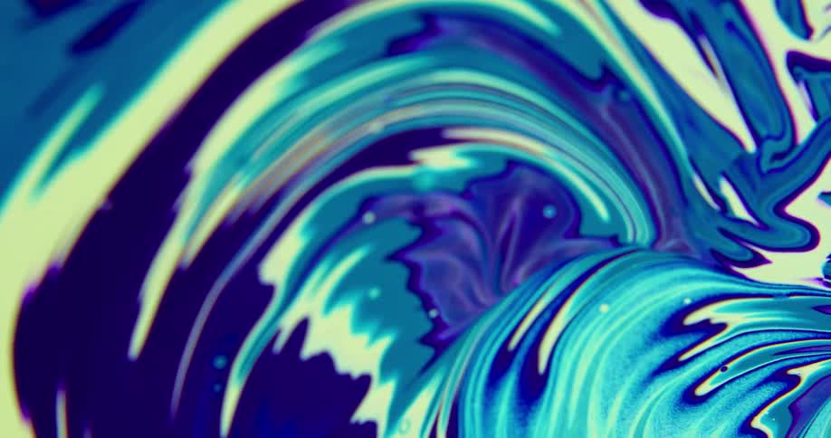 A spinning swirl of bright paint colors including blue yellow and purple