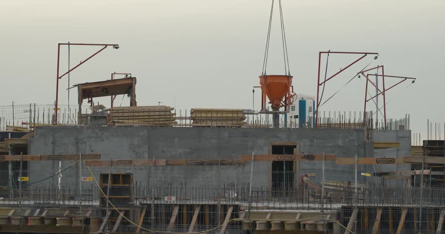 People are working on a building in a construction site