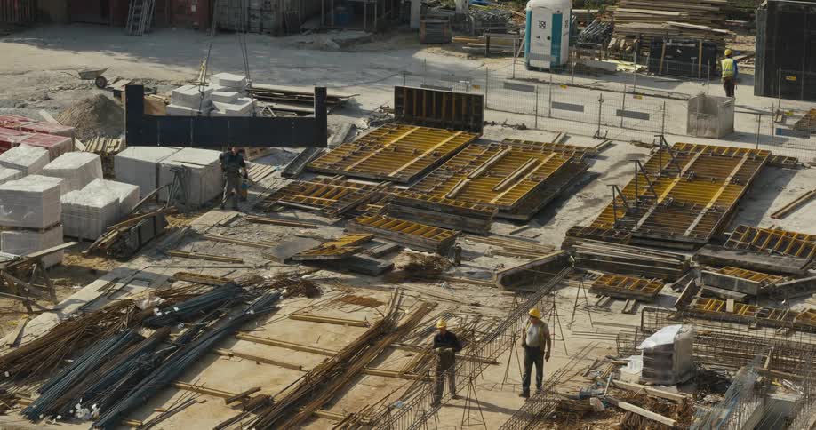Construction workers move on the site