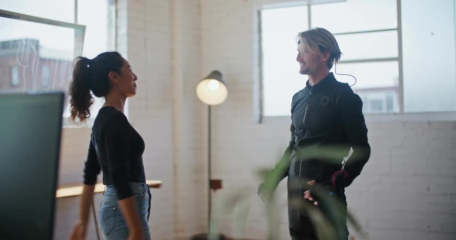 Man and woman are talking together in a room