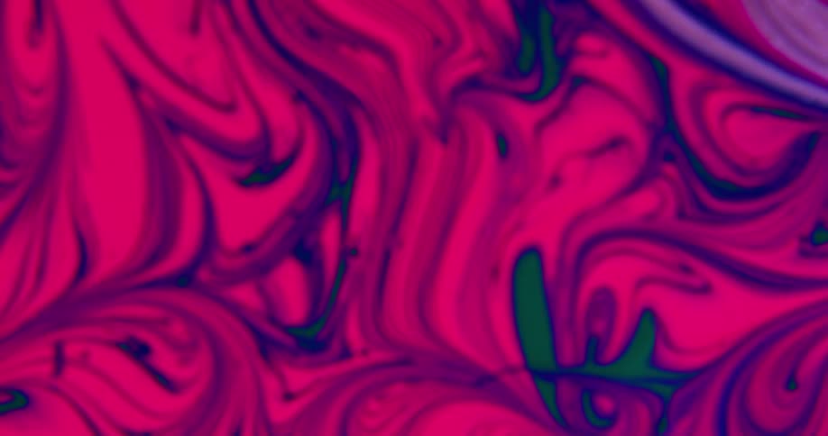 Pink paint swirled with greens and purples spinning around