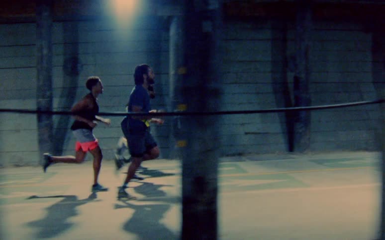 Three men run together on the trail