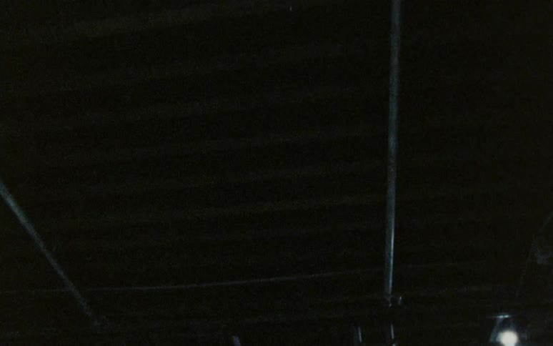The ceiling is covered with pipes