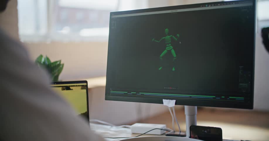 A person is moving on a monitor screen