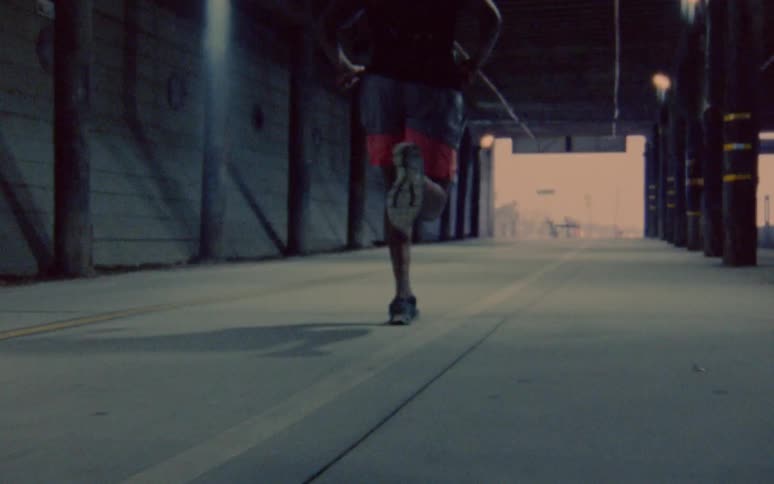 A man runs through a tunnel