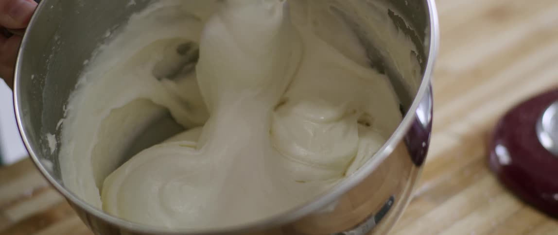 Batter is being mixed in a bowl