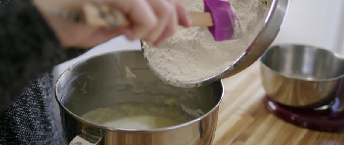Flower is being poured into a silver bowl