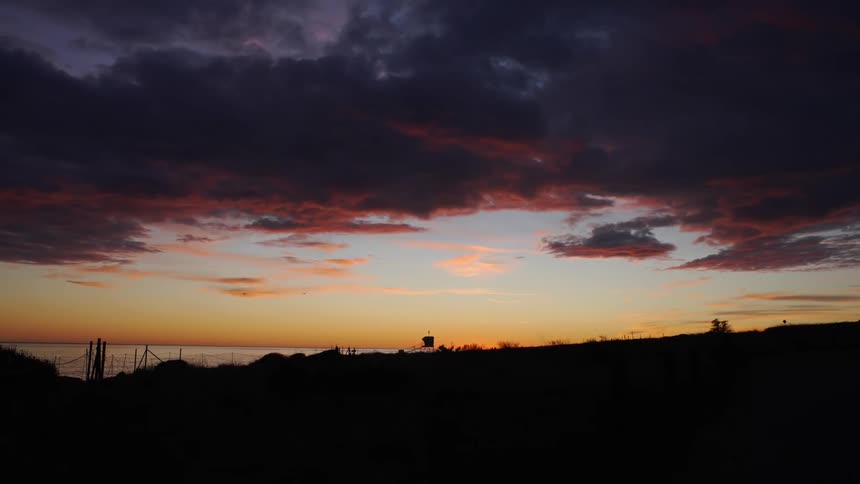 The sun is setting in the horizon in spring