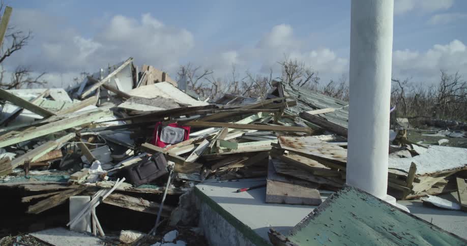Wreckage and rubble of a destroyed house in a residential area