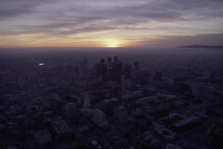 The sun is rising on the city