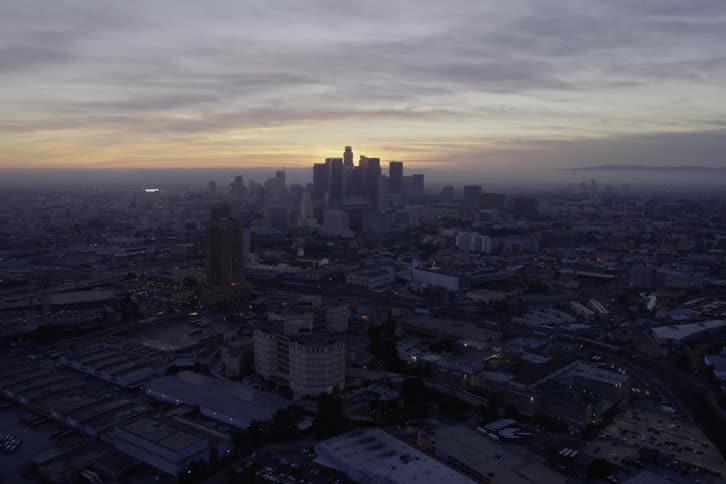 Metropolis aerial panoramic view at sunrise with skyline on the horizon