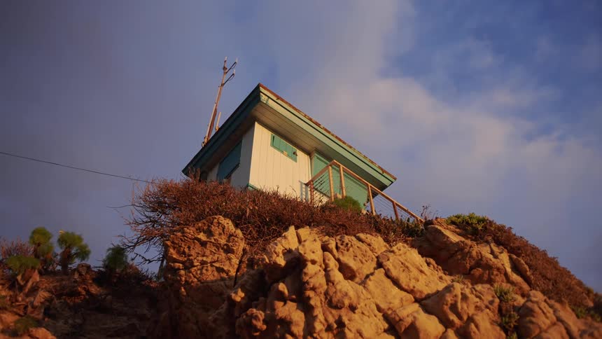 A light house is on a plateau in spring