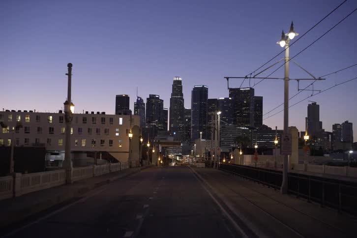 An empty highway in a downtown city is displayed