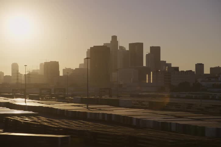 The sun is rising on the city