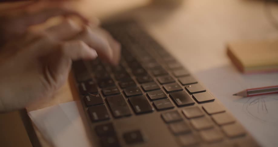 A person is typing on their keyboard